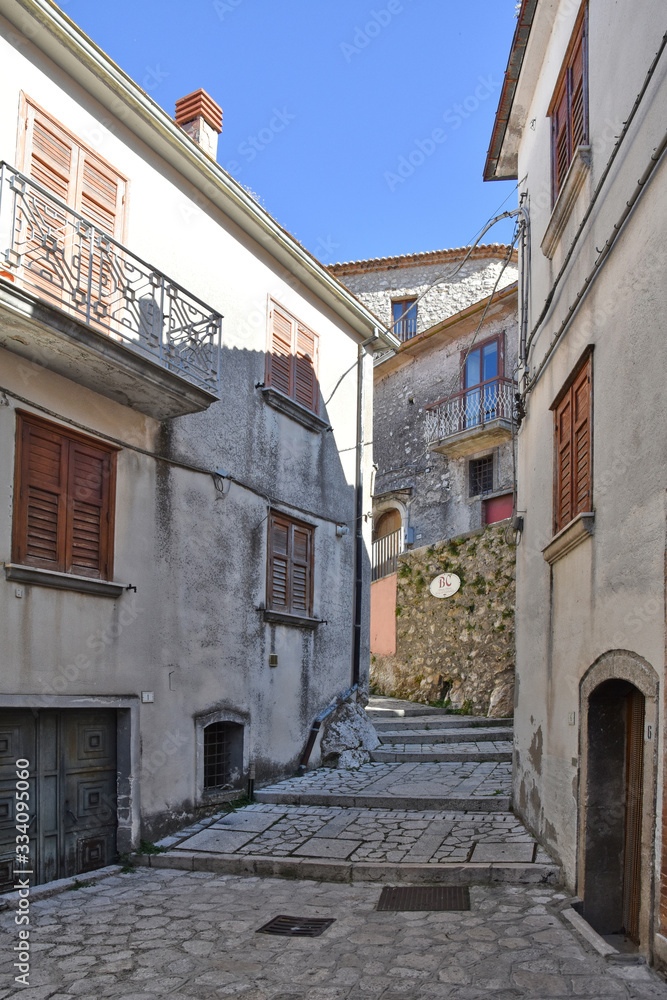 A narrow street between the old houses of Castelvetere sul Calore, village in the province of Avellino, Italy