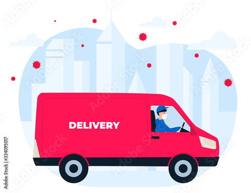 COVID-19. Quarantine in the city. Coronavirus epidemic. A courier in a protective medical mask delivers goods on a minivan