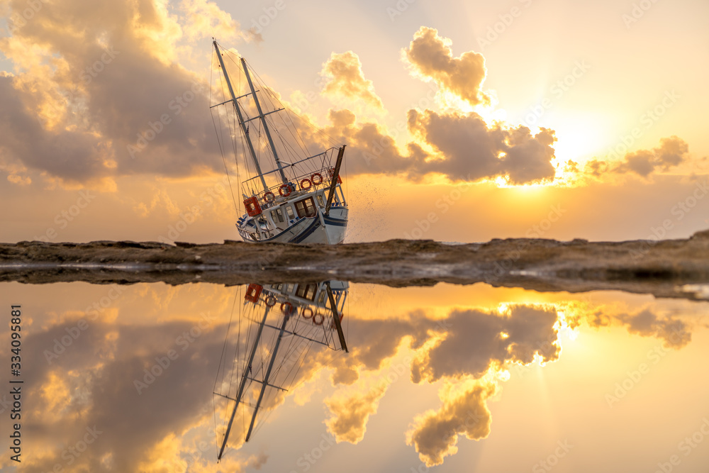 Sailing boat wreck at sunset