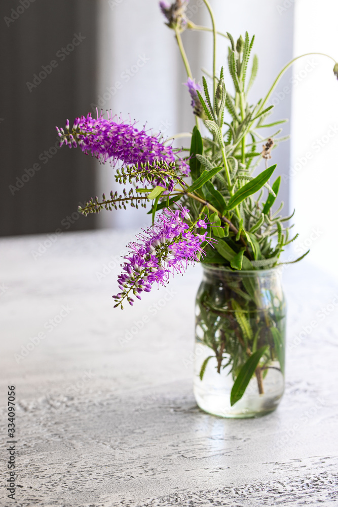 Fresh lavender flower bouquet in vase on the table. - obrazy, fototapety, plakaty 