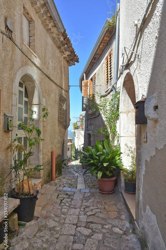Fototapeta Naklejka Na Ścianę i Meble -  A narrow street between the old houses of Castelvetere sul Calore, village in the province of Avellino, Italy