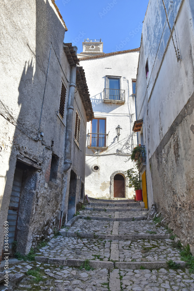 A narrow street between the old houses of Castelvetere sul Calore, village in the province of Avellino, Italy