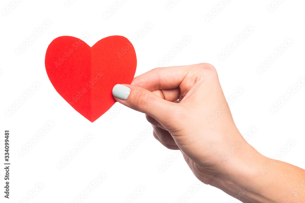 female hand isolated on white background holding paper heart   - Image