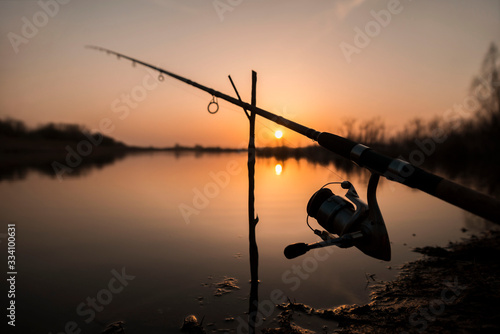 Carp fishing rod isolated on sunset. fishing rod silhouette