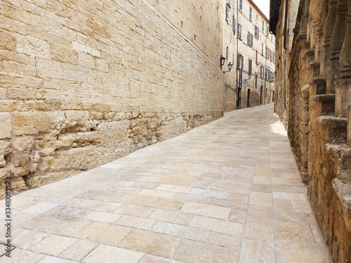 A narrow, deserted street in San Marino with ancient, stone houses. © Tanya