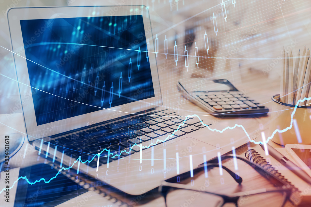 Stock market graph on background with desk and personal computer. Multi exposure. Concept of financial analysis. Stock market graph on background with desk and personal computer. Multi exposure. Concept of financial analysis.