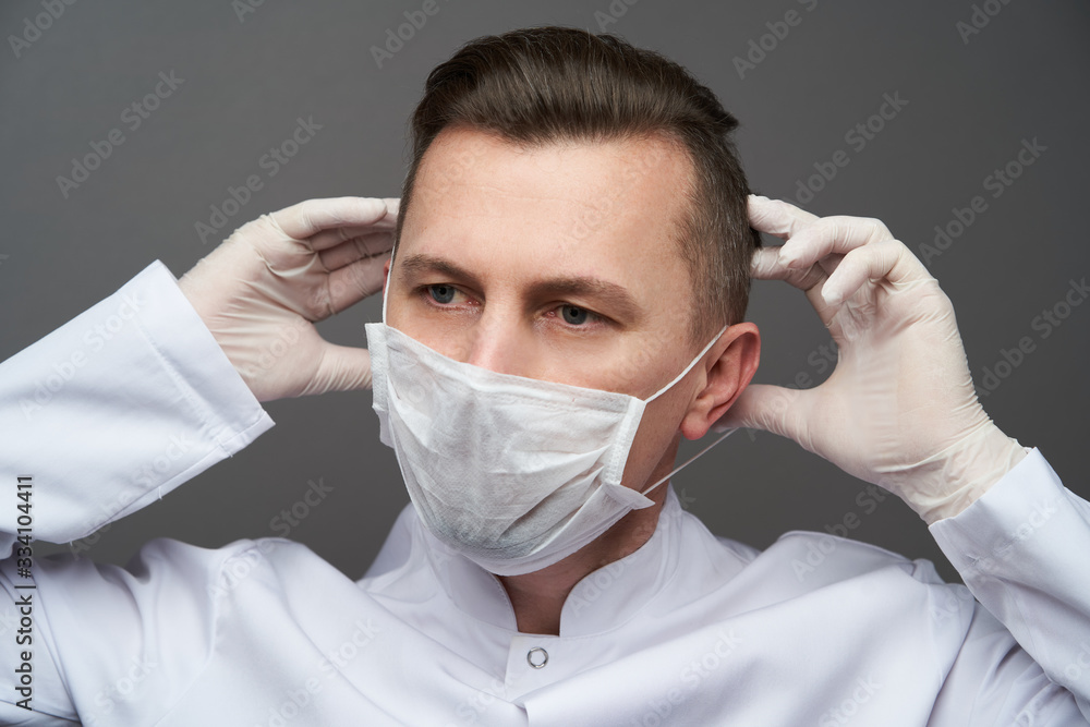Doctor wearing hygienic mask to prevent infection Doctor wearing hygienic mask to prevent infection