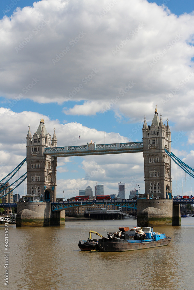 Obraz premium Tower Bridge with the blue sky and clouds on a bright sunny day in spring, London, UK
