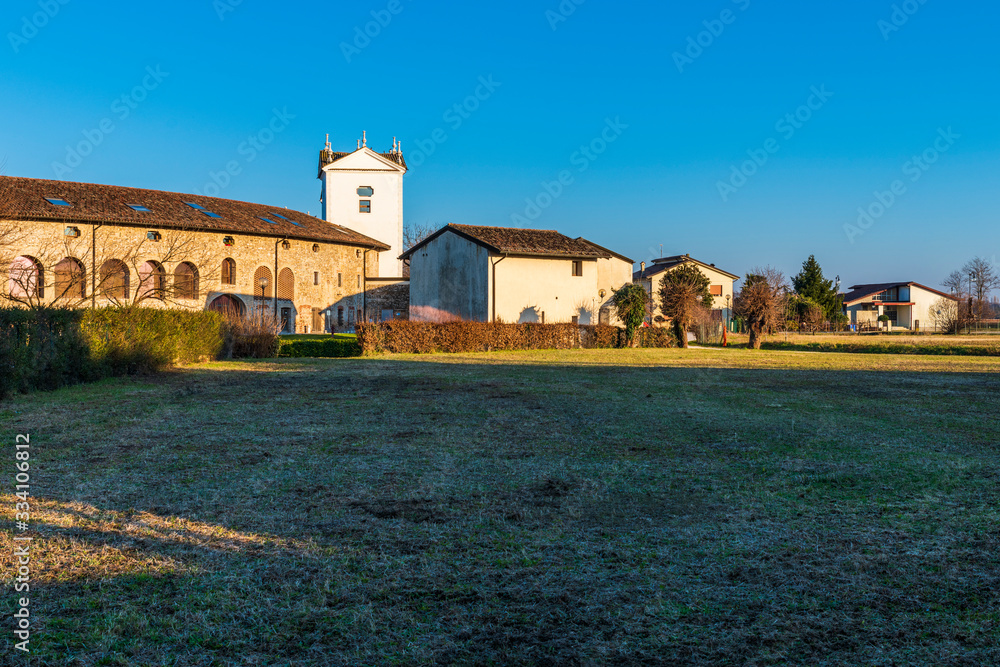 Sunset between the columns. Ancient residence of the Doge of Venice. Udine. Italy Sunset between the columns. Ancient residence of the Doge of Venice. Udine. Italy