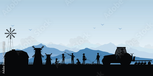 Silhouette of farmer driving a tractor in farmed land.