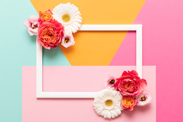 Happy Mother's Day, Women's Day, Valentine's Day or Birthday Pastel Colored Background.  Multicolored flat lay mock up greeting card with beautiful flowers.