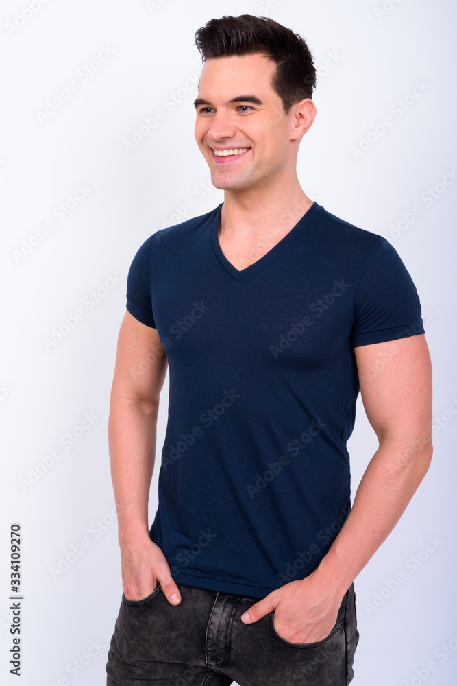 Fototapeta premium Portrait of happy young handsome man thinking