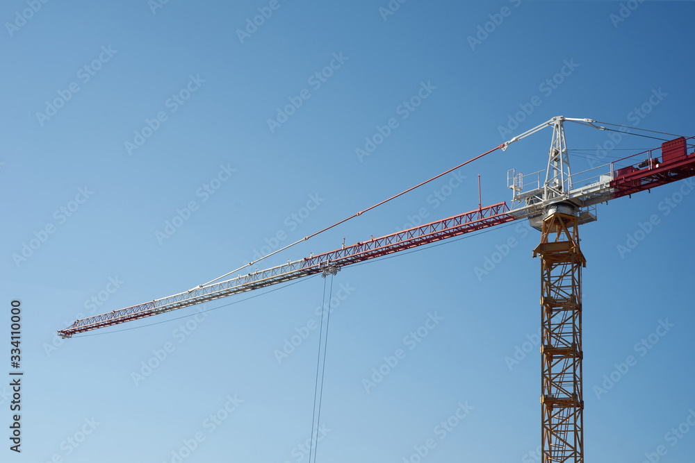 Working crane on a blue sky background