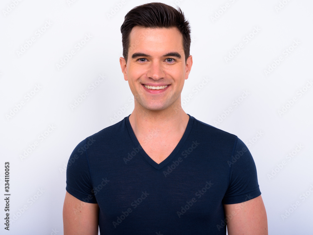 Face of happy young handsome man smiling Face of happy young handsome man smiling