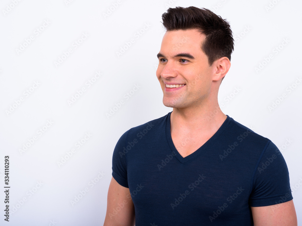 Face of happy young handsome man thinking Face of happy young handsome man thinking