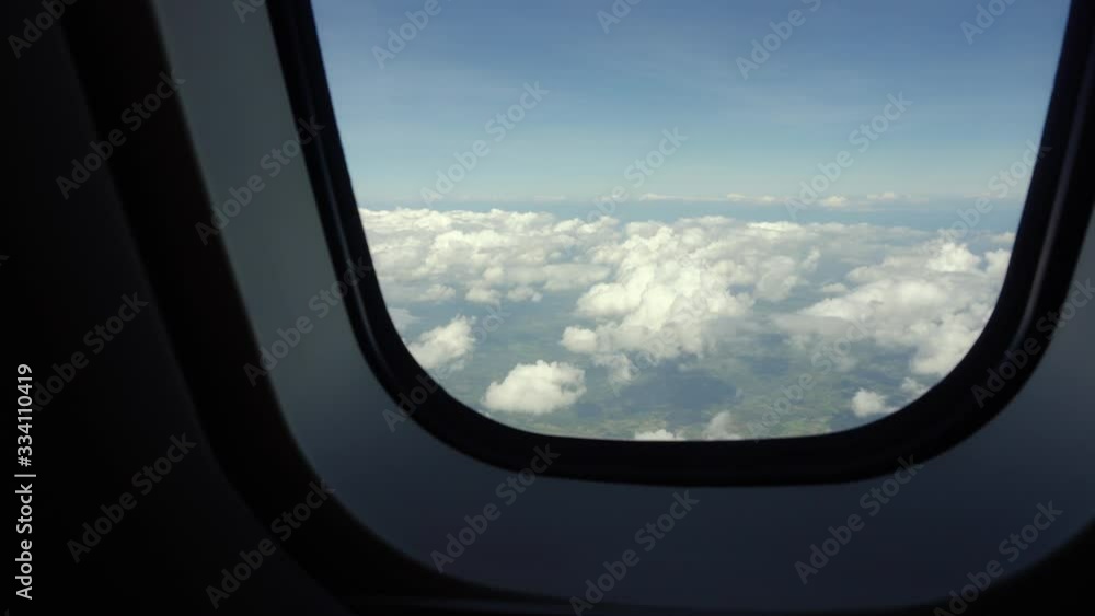 Sky in the porthole. Blue sky view from airplane window. Sky in the porthole. Blue sky view from airplane window.