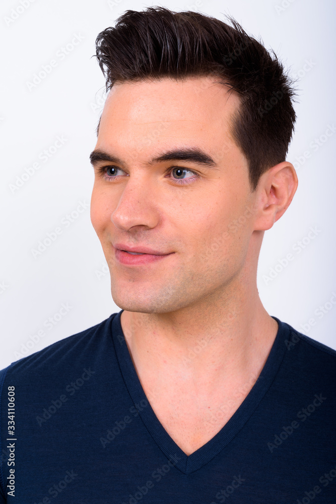 Fototapeta premium Face of young handsome man thinking and looking away