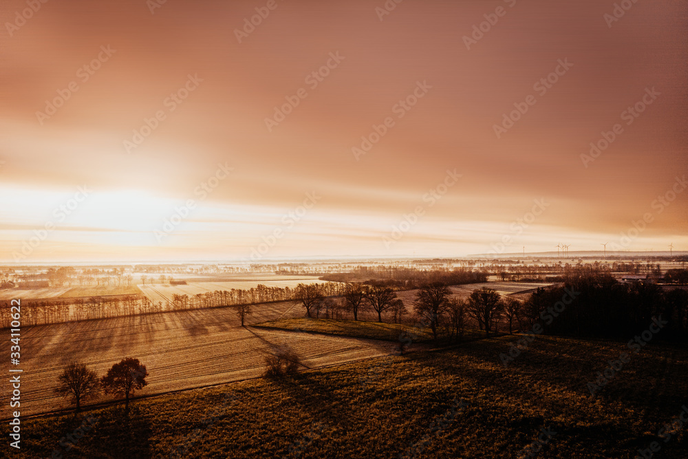 Obraz premium sunset over field with copyspace