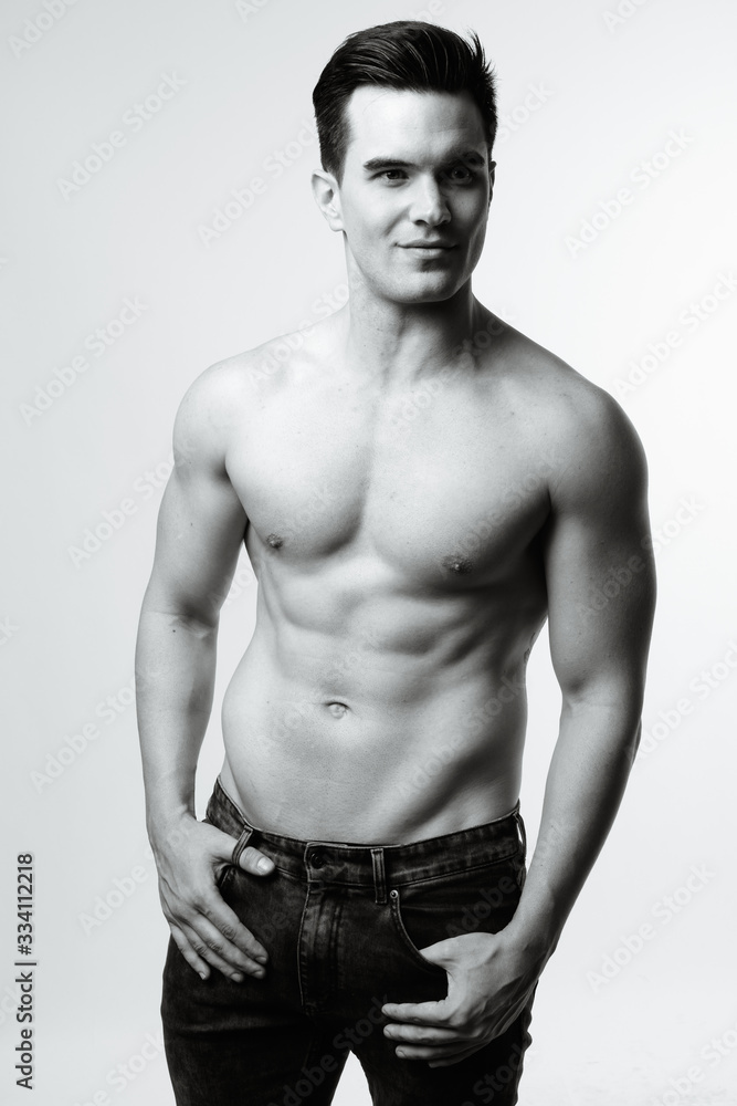 Fototapeta premium Young handsome man shirtless in black and white