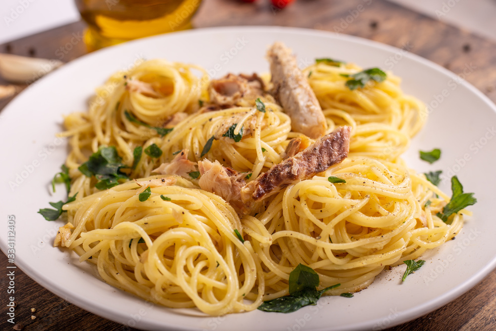 Seafood spaghetti with garlic and parsley. Healthy and nutritious Italian food. Blue fish, omega 3 recipe. Seafood spaghetti with garlic and parsley. Healthy and nutritious Italian food. Blue fish, omega 3 recipe.