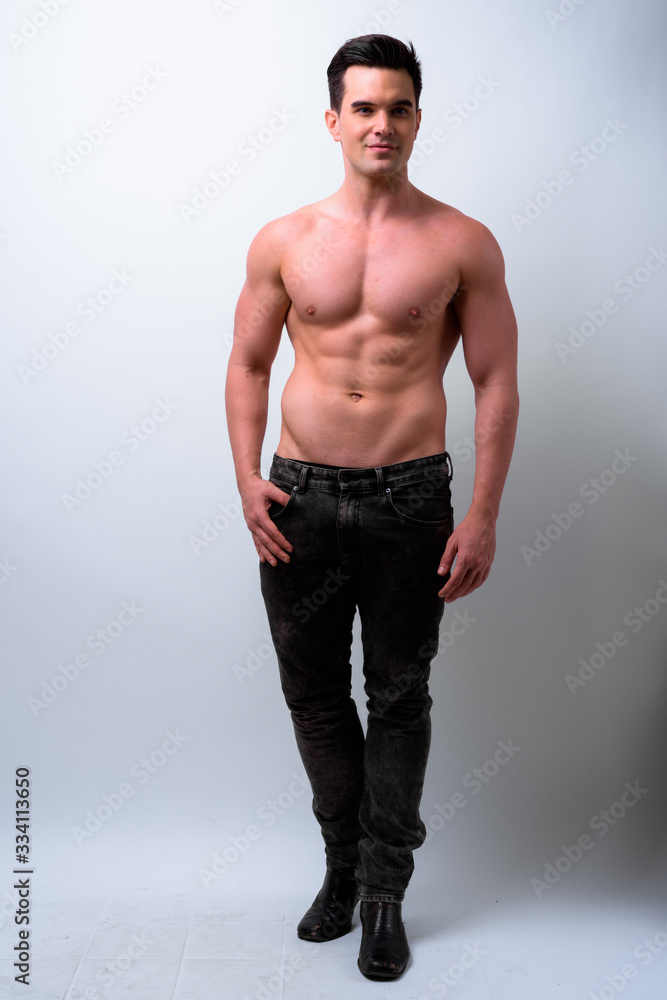 Full body shot of young handsome muscular man shirtless Full body shot of young handsome muscular man shirtless