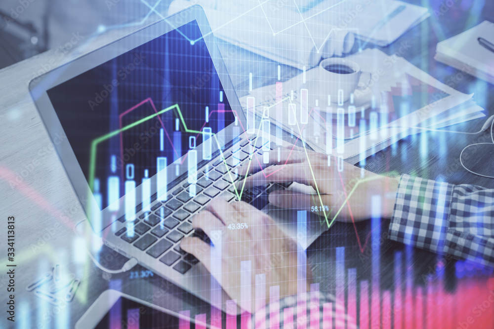 Double exposure of forex graph with man working on computer on background. Concept of market analysis. Double exposure of forex graph with man working on computer on background. Concept of market analysis.