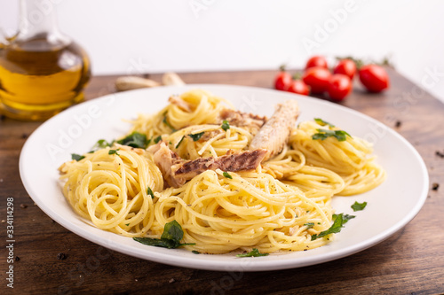  Seafood spaghetti with garlic and parsley. Healthy and nutritious Italian food. Blue fish, omega 3 recipe.