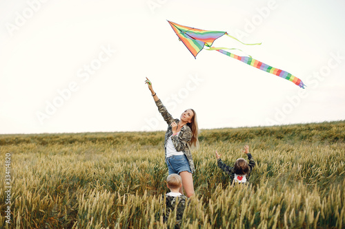 Mother with two children. Family with a Kite. Brother with a little sister