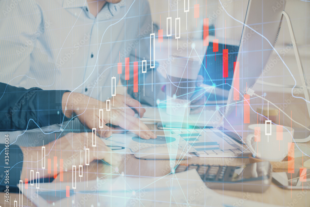 Multi exposure of chart with man typing on computer in office on background. Concept of hard work. Multi exposure of chart with man typing on computer in office on background. Concept of hard work.