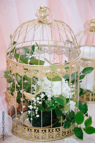 birdcage with flowers, wedding dinner