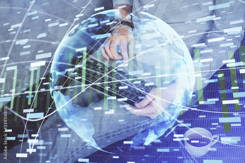 Double exposure of businessman working on laptop on background. International business hologram in front. Concept of success. Double exposure of businessman working on laptop on background. International business hologram in front. Concept of success.