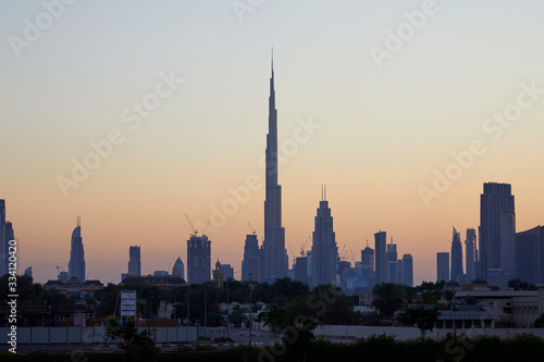 Dubai skyline with Burj Khalifa skyscraper at sunset  clear sky in United Arab Emirates