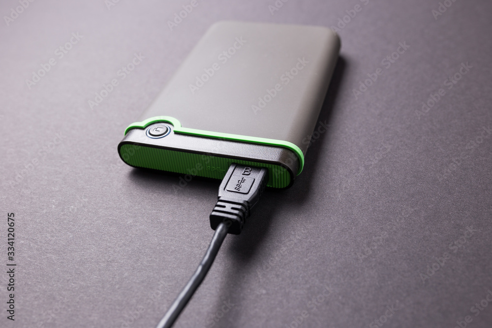 Fototapeta premium Hard disk on a black isolated background close-up.