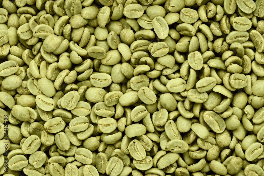 Green coffee beans background. Texture top view. Green coffee beans background. Texture top view.