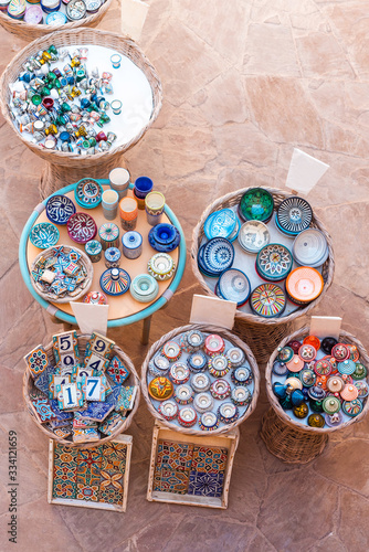 Moroccan ceramic cookware sold on the market in Essaouira, Morocco. Top view. Vertical.