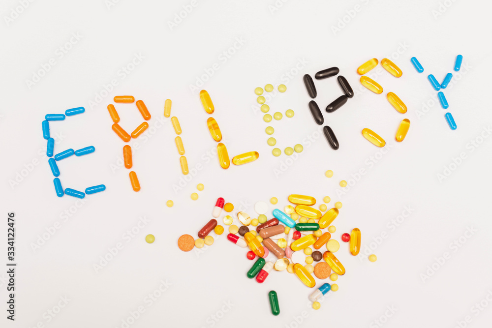 High angle with of epilepsy lettering near pills on white background High angle with of epilepsy lettering near pills on white background