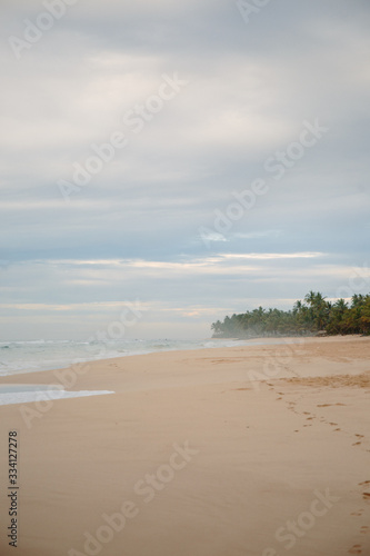 The coast of the Indian Ocean at dawn in Sri Lanka in March 2020. Calm beautiful water and azure blue waves