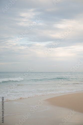 The coast of the Indian Ocean at dawn in Sri Lanka in March 2020. Calm beautiful water and azure blue waves