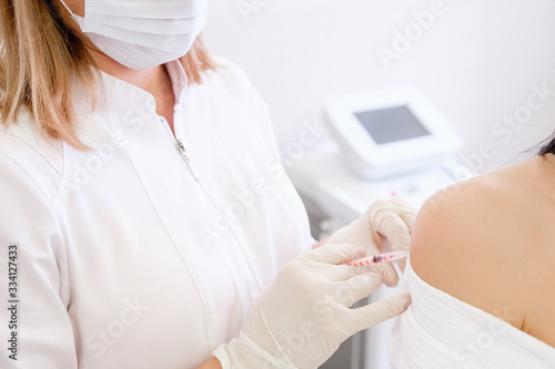 Young unidentified woman immunologist doctor vaccines a young caucasian girl. Vaccine ambiguous concept. Vaccination consequences and saved lives from vaccinations