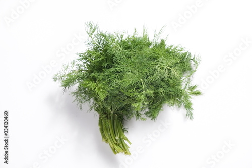 Clean eating concept. Bunch of ripe juicy freshly picked organic green dill isolated on white background. Healthy diet for spring summer detox. Vegan raw food. Close up.