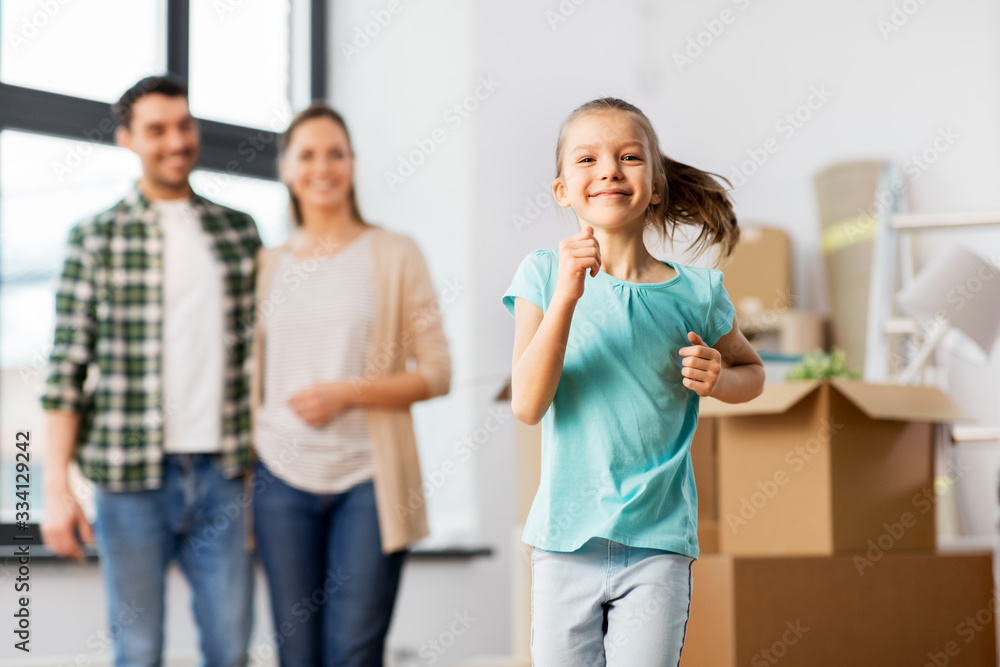mortgage, family and real estate concept - happy mother, father and little daughter with stuff in boxes moving to new home mortgage, family and real estate concept - happy mother, father and little daughter with stuff in boxes moving to new home
