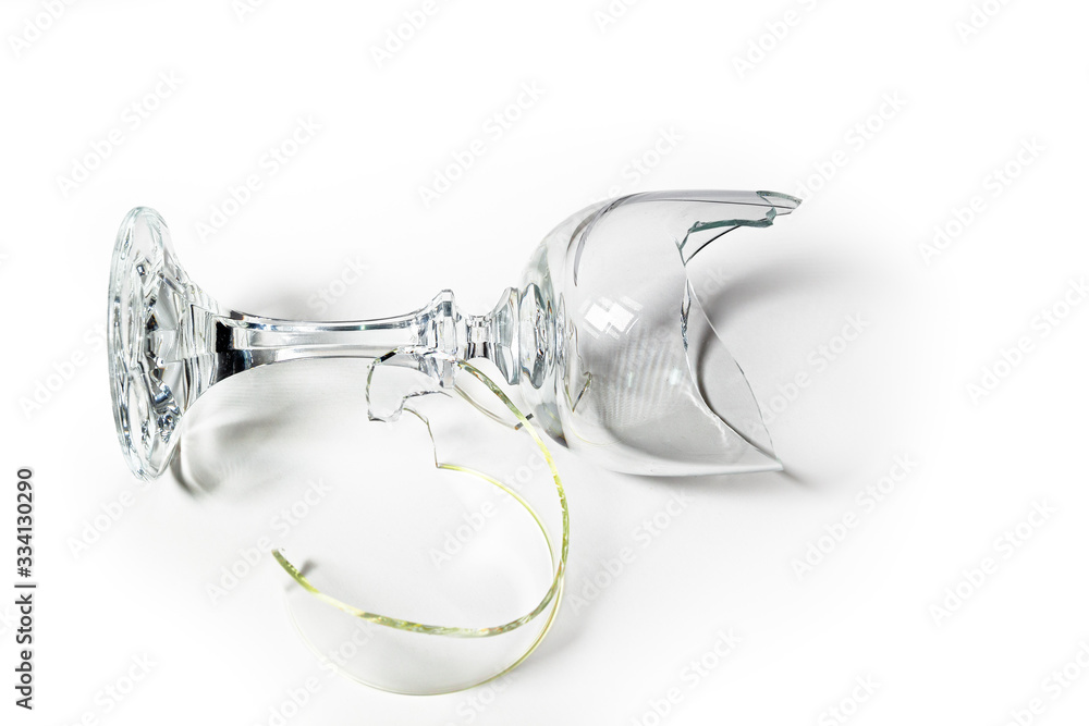 A broken goblet glass on a white background.