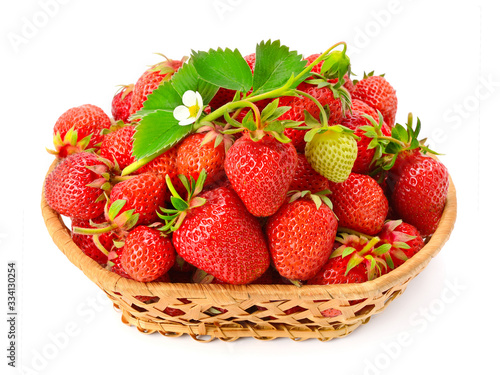 Basket with sweet strawberries isolated on white background.