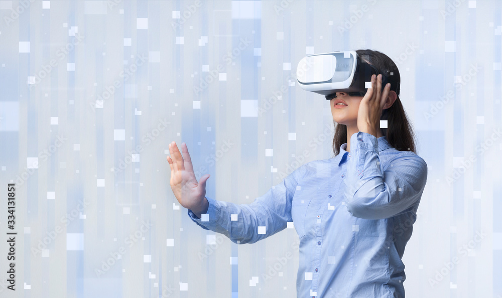 Young lady using VR headset on pixelated cyberspace background, blank space. Collage Young lady using VR headset on pixelated cyberspace background, blank space. Collage