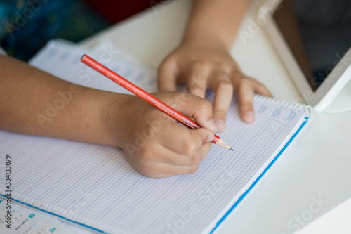 boy doing homework at home