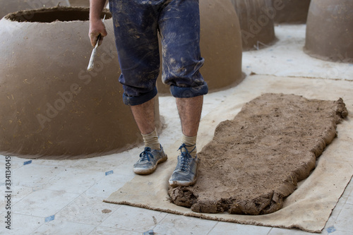 Man making term tandoor in Uzbekistan