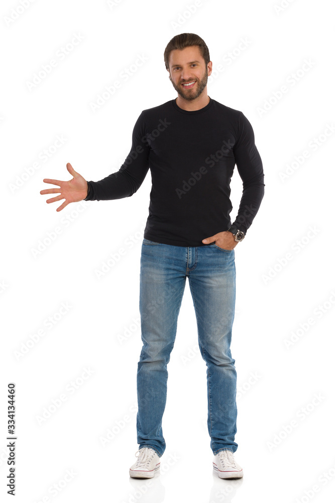 Confident Man Is Standing And Showing Open Hand Confident Man Is Standing And Showing Open Hand