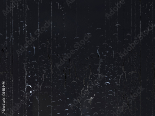 Abstract dark gray background. Shiny drips on a dark backdrop.