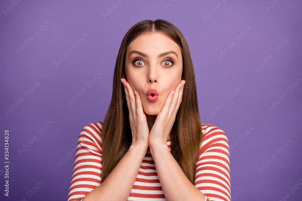 Closeup photo of crazy cute funny lady good mood long perfect hairstyle open mouth crazy news arms on cheeks wear casual striped shirt isolated pastel purple color background Closeup photo of crazy cute funny lady good mood long perfect hairstyle open mouth crazy news arms on cheeks wear casual striped shirt isolated pastel purple color background