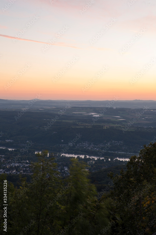 Skyline over the Rhine into a German low mountain range at sunset